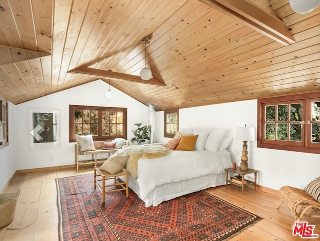 bedroom with wood ceiling, light hardwood / wood-style floors, and vaulted ceiling with beams