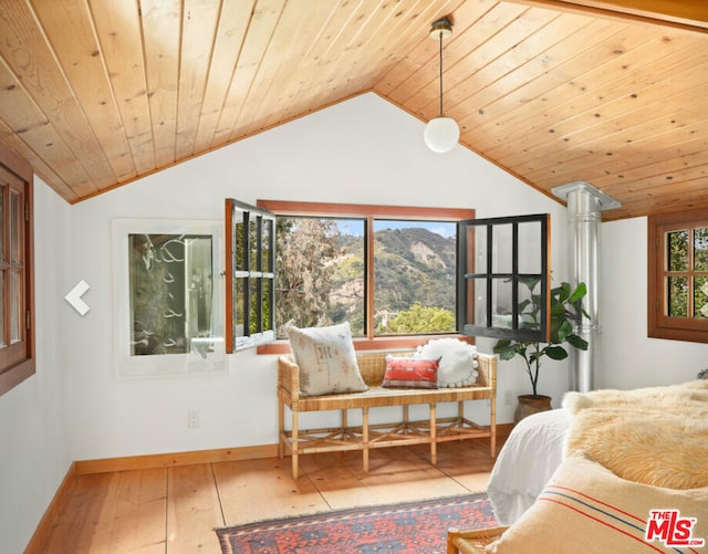 bedroom with hardwood / wood-style flooring, vaulted ceiling, multiple windows, and wooden ceiling