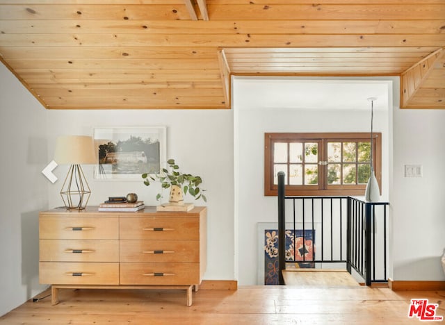 interior space featuring lofted ceiling, wood ceiling, and light hardwood / wood-style flooring