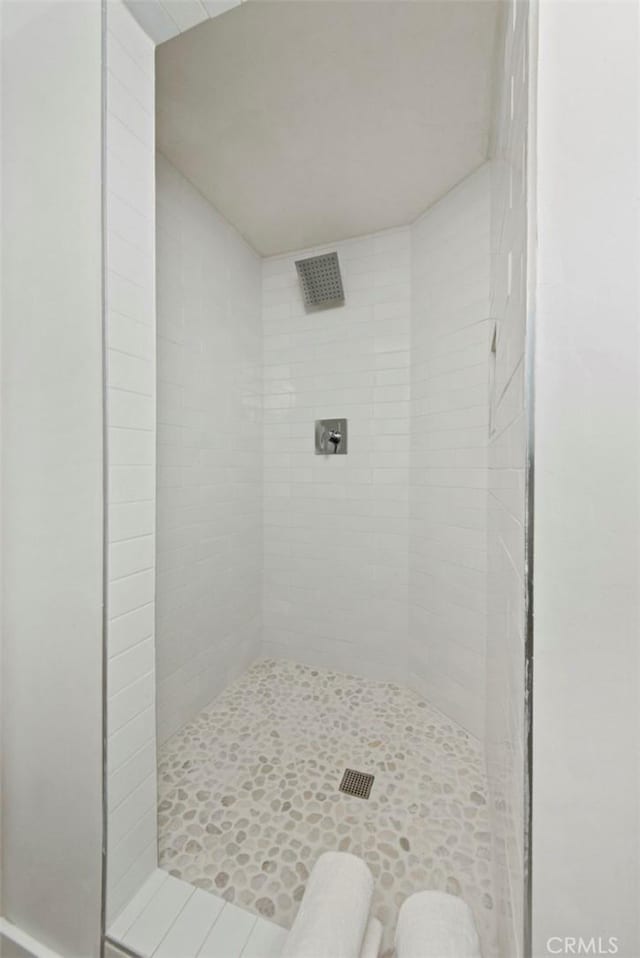 bathroom with tiled shower