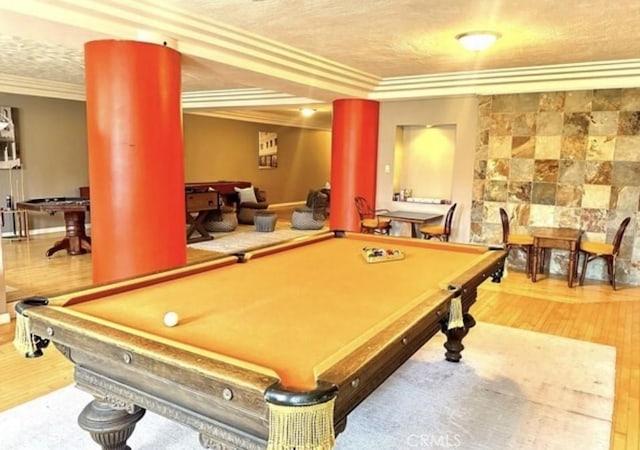 game room featuring crown molding, pool table, and hardwood / wood-style flooring