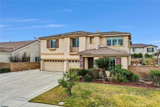 view of front of property with a garage and a front lawn