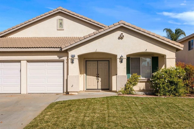 view of front of property with a garage and a front lawn