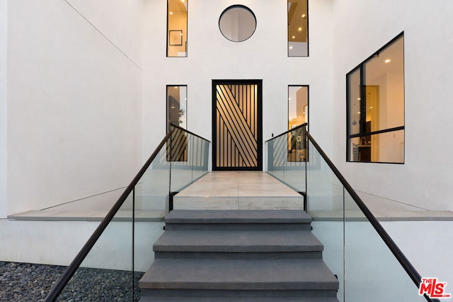 stairway with a towering ceiling