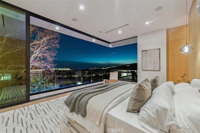 bedroom featuring expansive windows