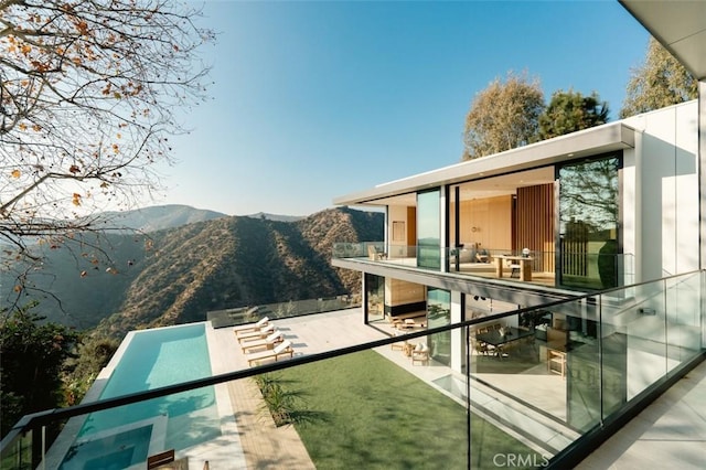 view of swimming pool featuring a mountain view