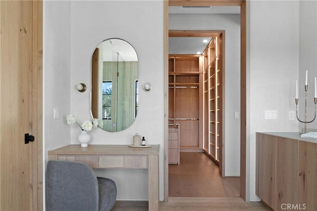 bathroom featuring hardwood / wood-style flooring and vanity