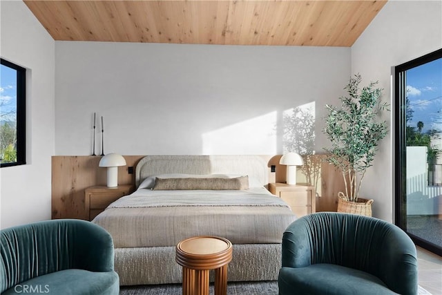 bedroom featuring access to exterior and wooden ceiling