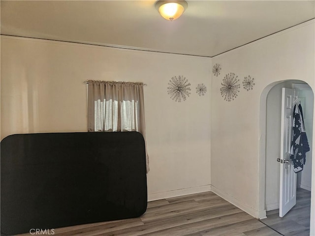 unfurnished room featuring hardwood / wood-style floors