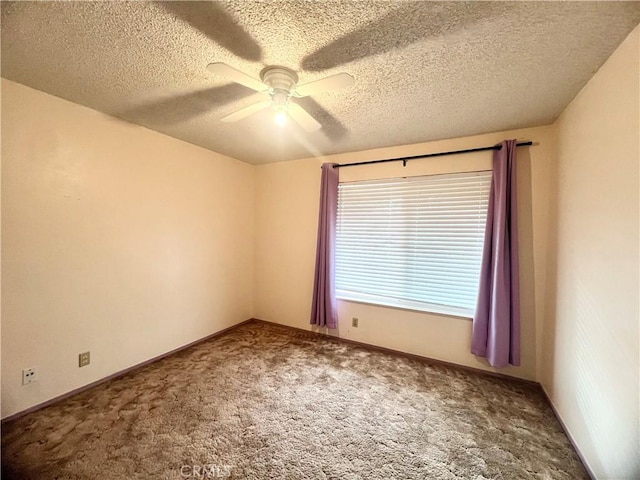 carpeted empty room with a textured ceiling and ceiling fan