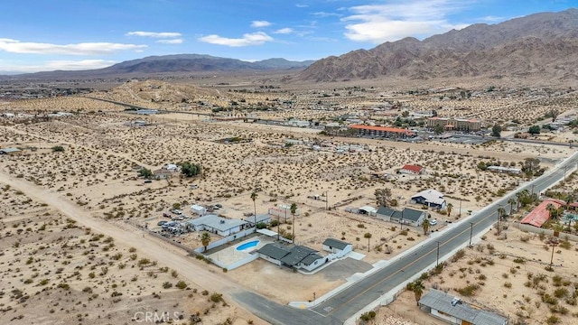 birds eye view of property with a mountain view