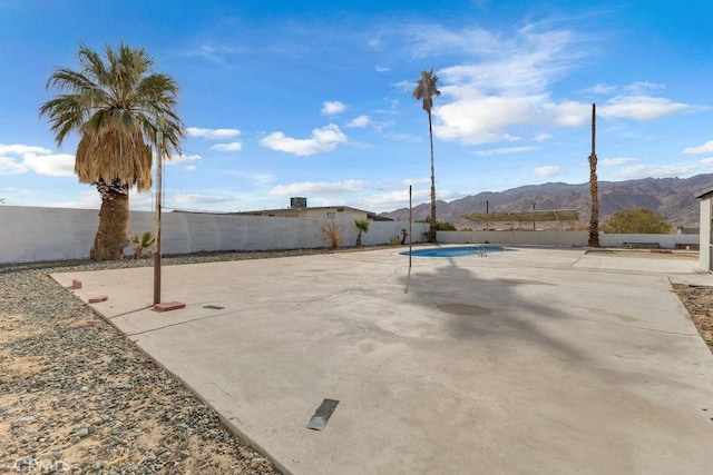 view of patio / terrace with a mountain view