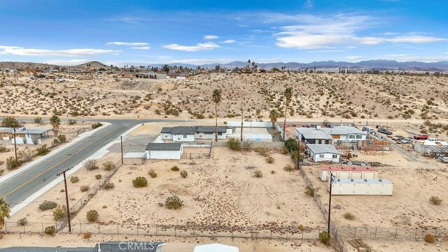 birds eye view of property featuring a mountain view