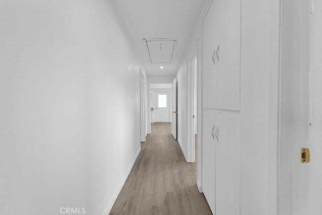 corridor with light wood-type flooring