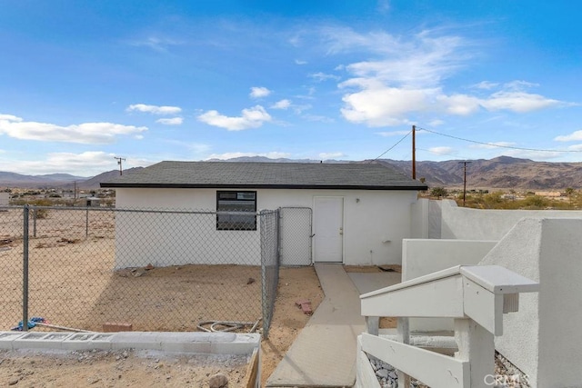 view of property exterior featuring a mountain view