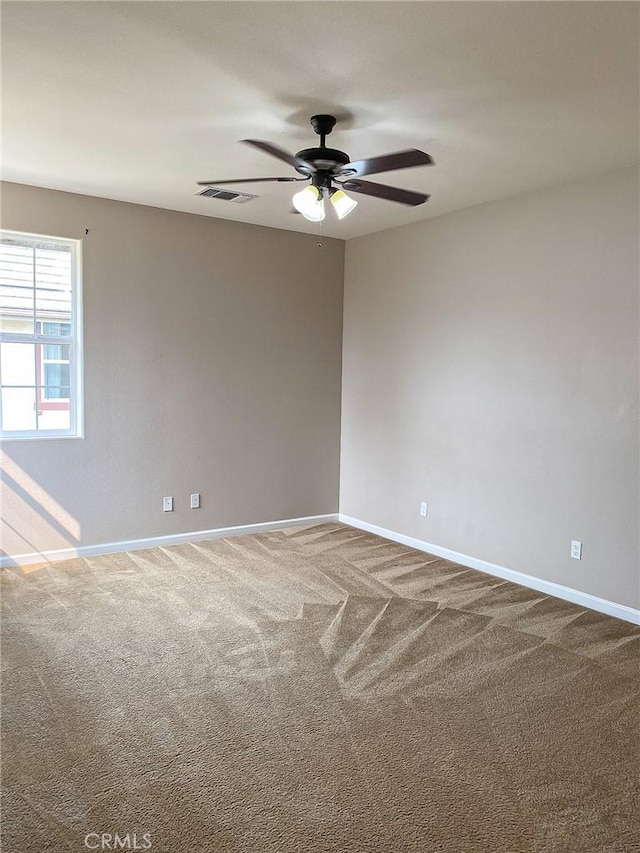 carpeted empty room with ceiling fan