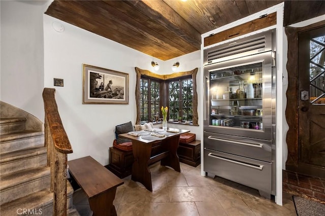 tiled office featuring wooden ceiling