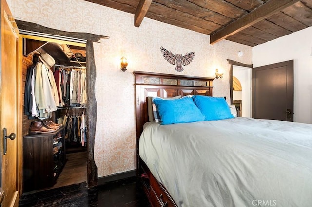 bedroom with wood ceiling, dark hardwood / wood-style floors, and beamed ceiling