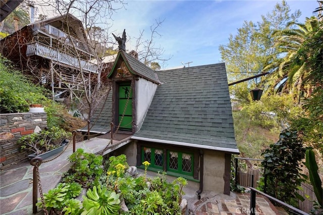 view of property exterior featuring a balcony