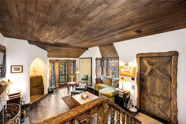 living area featuring hardwood / wood-style flooring, lofted ceiling, and wooden ceiling