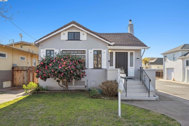 bungalow with a front yard