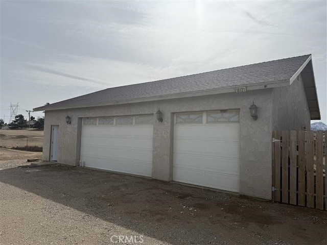 garage with fence