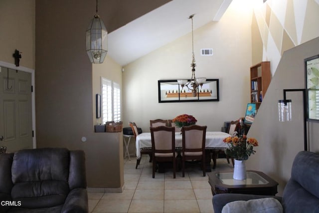 tiled dining room with an inviting chandelier and high vaulted ceiling