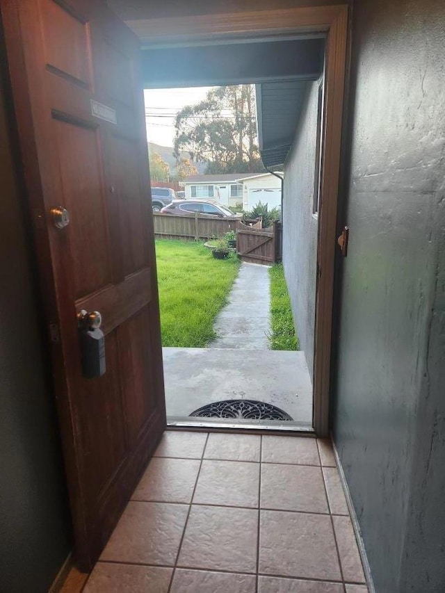 doorway featuring light tile patterned floors