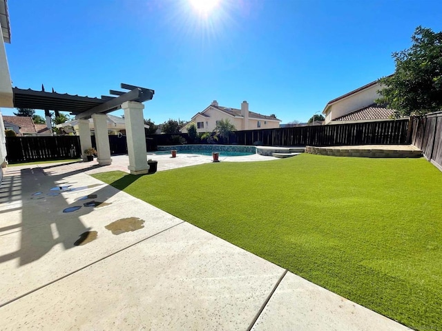 view of yard with a fenced in pool, a pergola, and a patio area