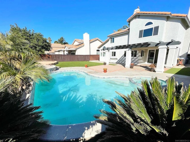 view of swimming pool featuring a pergola and a patio