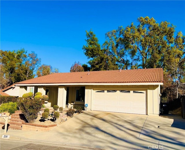 ranch-style house featuring a garage