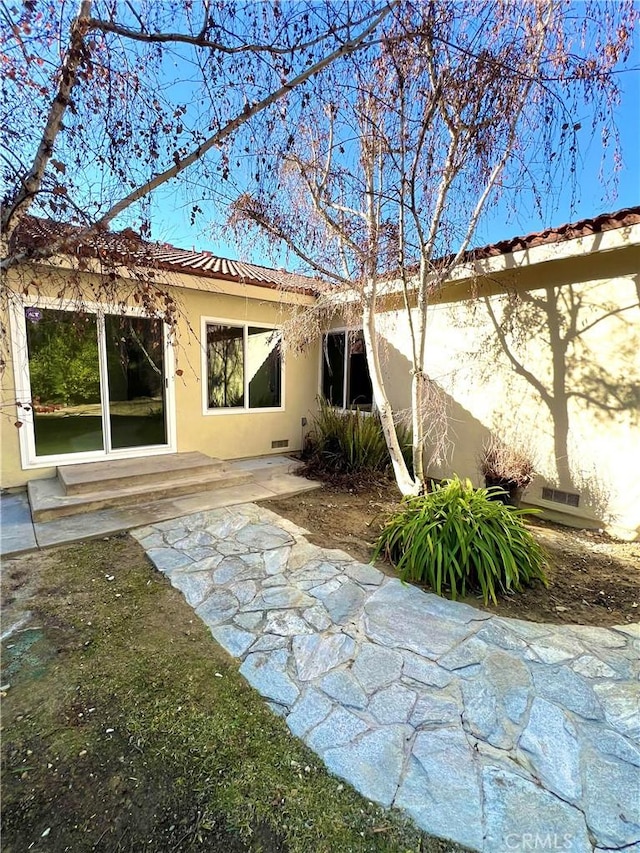 back of house featuring a patio area