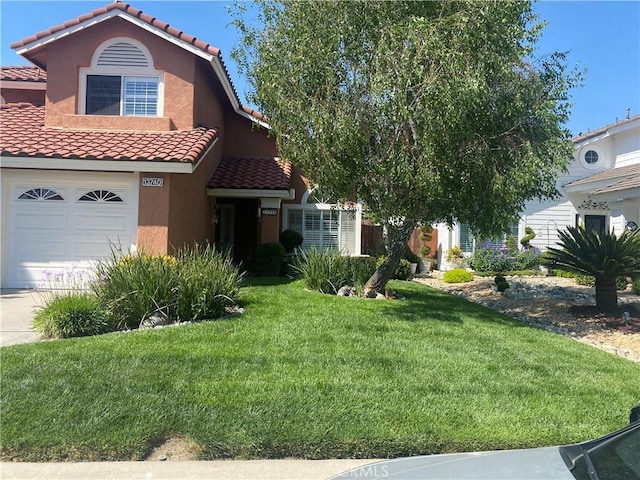 view of front facade with a garage and a front yard