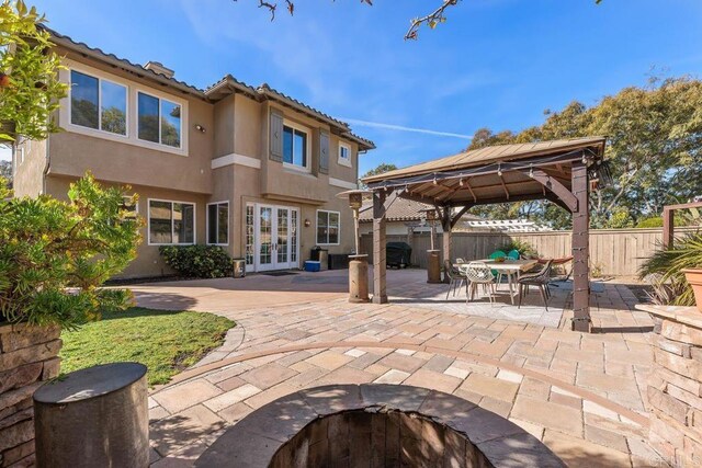 view of patio / terrace featuring a gazebo and french doors