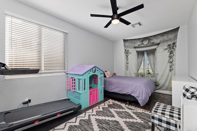 bedroom with ceiling fan and hardwood / wood-style floors