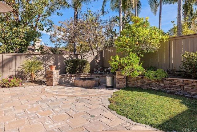 view of patio featuring an outdoor fire pit