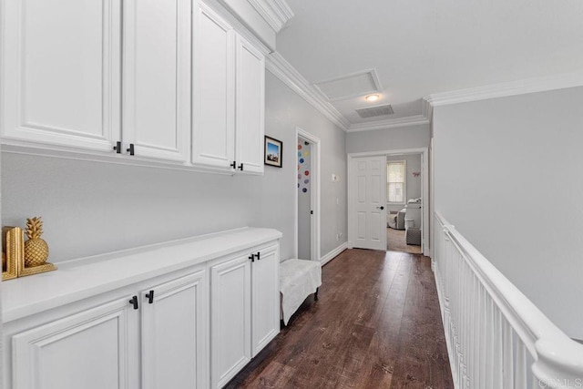 hallway featuring crown molding and dark hardwood / wood-style flooring