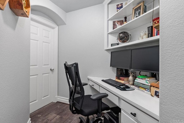 office with dark hardwood / wood-style flooring