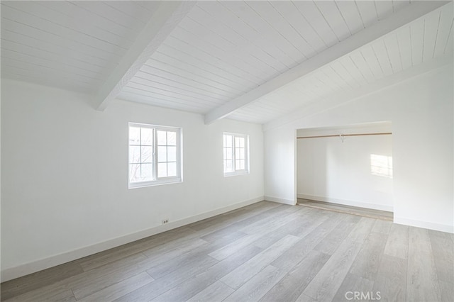 interior space featuring lofted ceiling with beams and light wood-type flooring