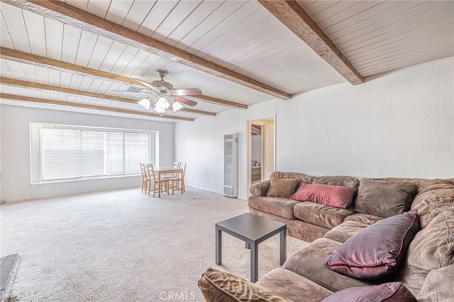 carpeted living room with ceiling fan, beam ceiling, and wooden ceiling