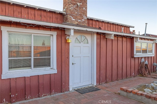 entrance to property featuring a patio area