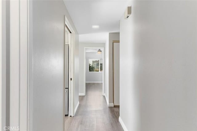 corridor featuring light wood-type flooring