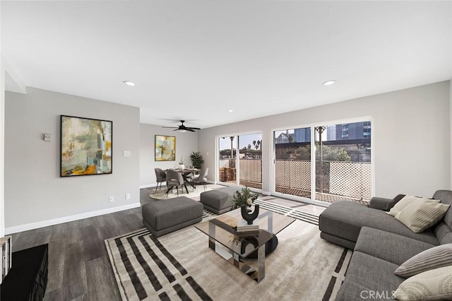 living room with hardwood / wood-style flooring and ceiling fan