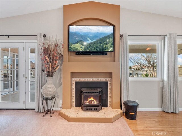 living room with hardwood / wood-style flooring and vaulted ceiling