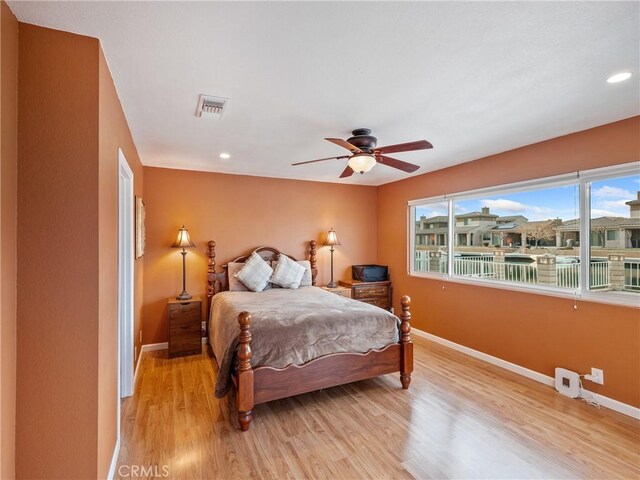 bedroom featuring ceiling fan and light wood-type flooring