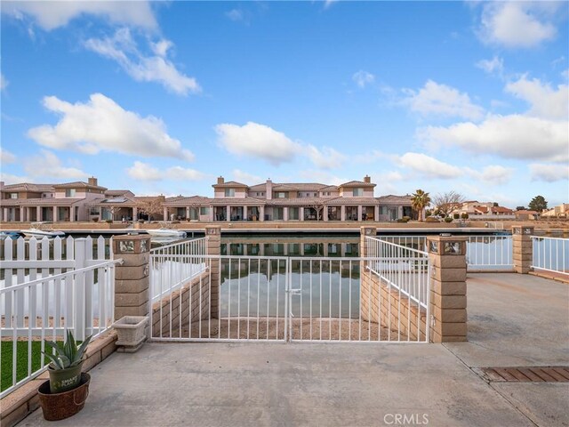 view of gate featuring a water view