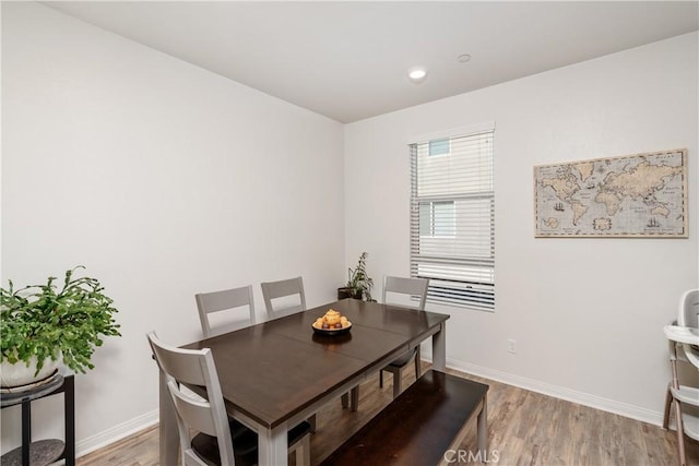 dining area with light hardwood / wood-style flooring