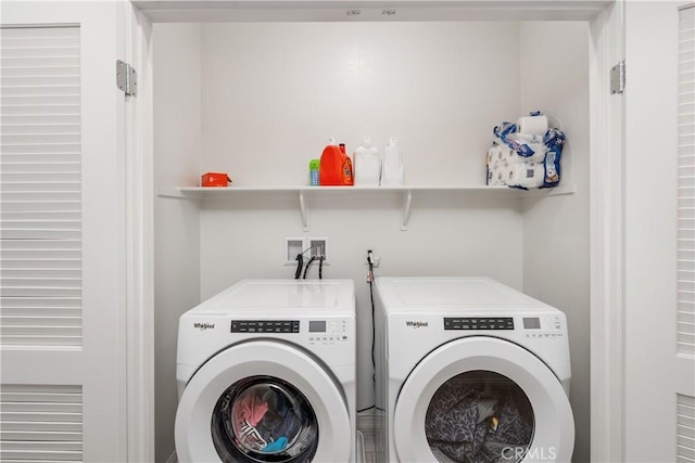 washroom featuring washer and dryer