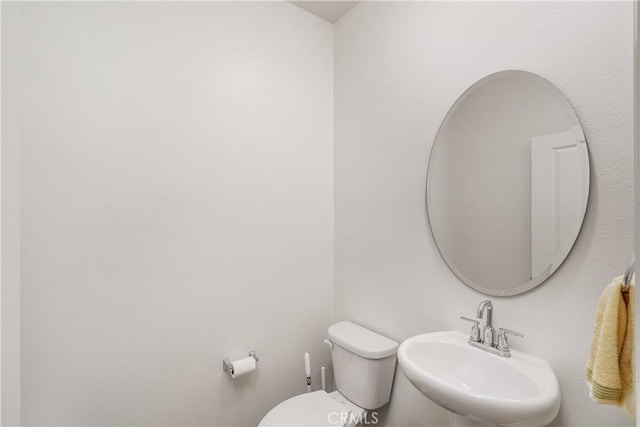 bathroom with sink and toilet