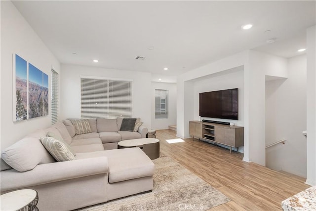 living room with light hardwood / wood-style flooring